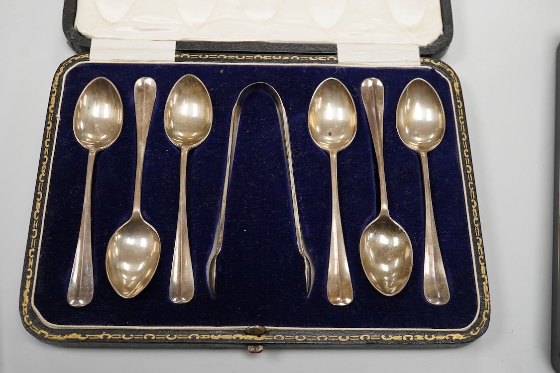 A cased Edwardian silver christening pair by Goldsmiths and Silversmiths Co Ltd, London, 1905, two cased sets of six silver teaspoons, one with a pair of sugar tongs, one other cased silver christening pair, a cased set